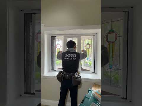 Retractable Flyscreen Installed On A Bay Window