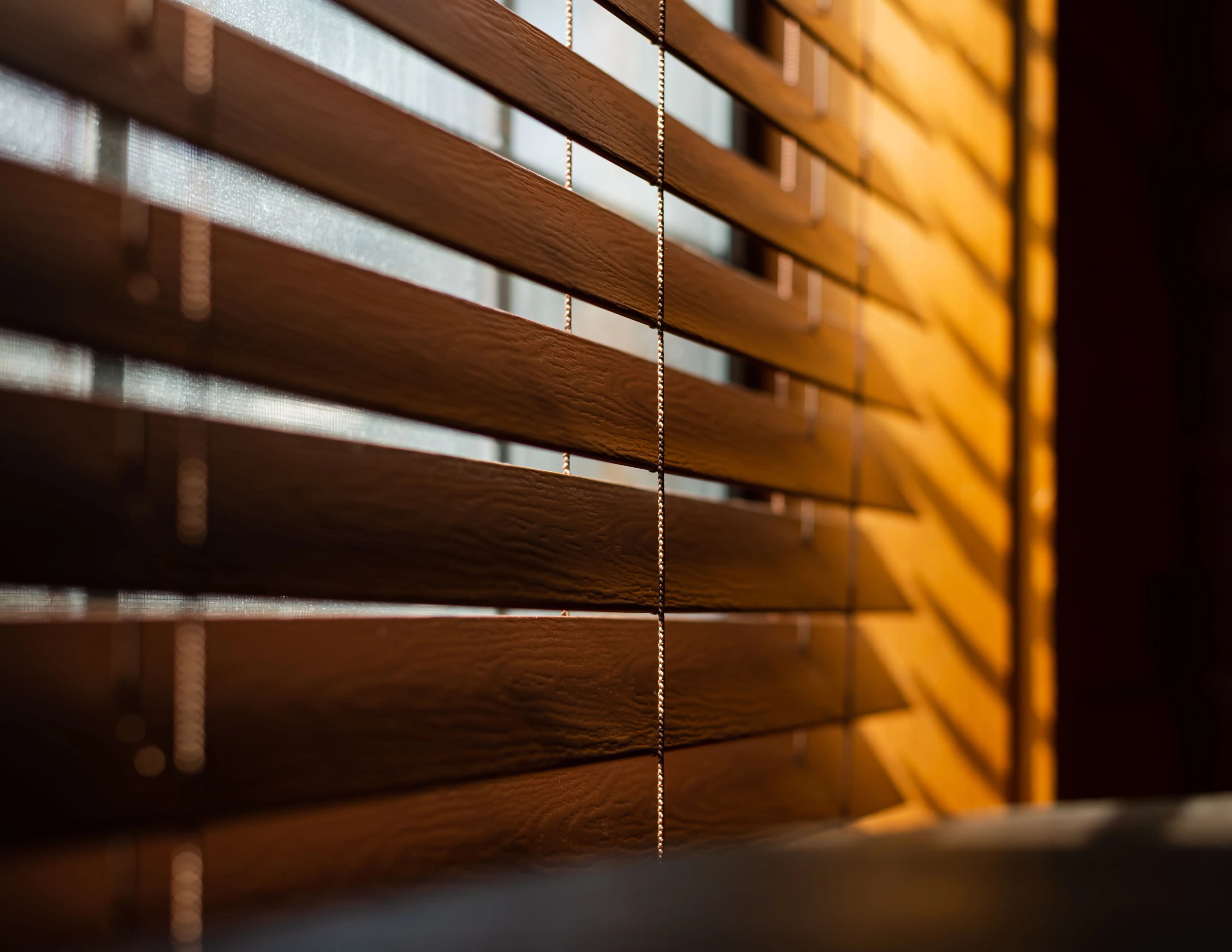 Wooden Venetian blinds in a warm interior